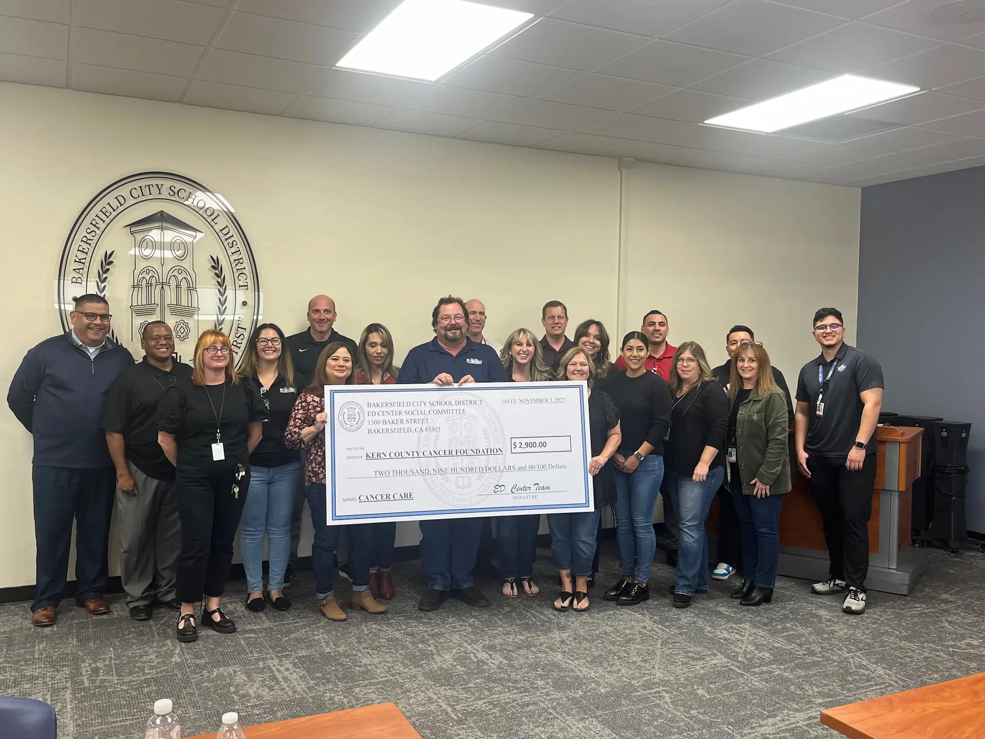 Employees from Bakersfield City School District Ed Center Present Kern County Cancer Foundation a check
